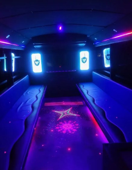 Blue san antonio party bus inside view at night lights on