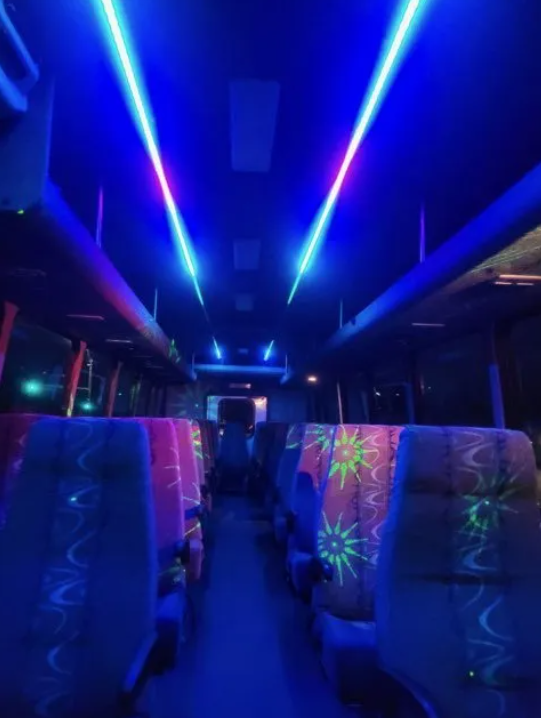 san antonio shuttle bus inside view with night lights on